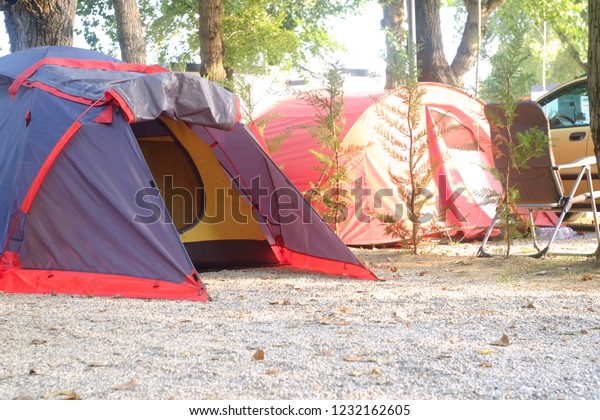 tent for travel is on the\
ground where tourists sleep, the theme of travel and outdoor\
activities\

