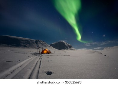 Tent Under Northern Lights In Lapland - Sweden