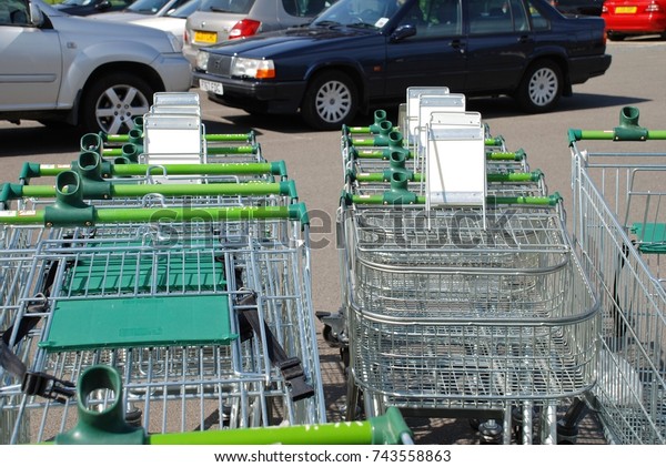 TENTERDEN, ENGLAND - MAY 17, 2008: Shopping\
trolleys outside a branch of supermarket chain Waitrose in Kent,\
England. Part of the John Lewis Partnership, the first Waitrose\
supermarket opened in\
1955.