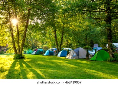 Tents Camping area, early morning, beautiful natural place with big trees and green grass, Europe - Shutterstock ID 462419059