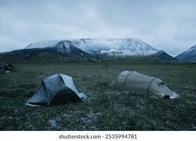 Tents covered in frost amidst Kamchatka’s snowy landscapes, capturing the spirit of winter camping - Powered by Shutterstock