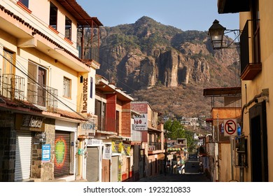 Tepoztlan, Morelos, Mexico February 20th 2021 Del Tepozteco Street Empty With Closed Shops And Hotels On A Beautiful Sunny Saturday Morning, On The Background, The Tepozteco Mountain.