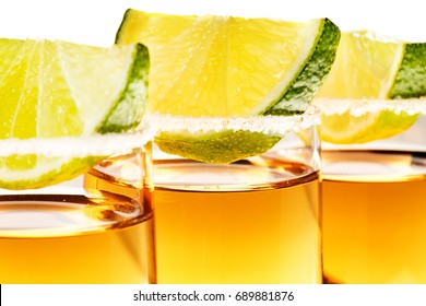 Tequila Shot Glasses Garnished With Salt And Lime