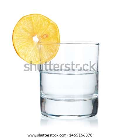  tequila shot with juicy lemon slices  on white background
