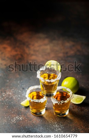 Tequila shots with salt and lime, selective focus image