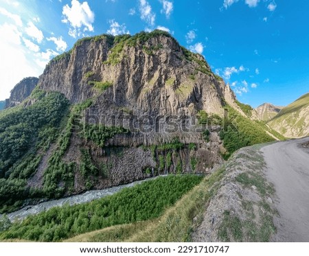The Terek (Tergi) river flows down the Truso Valley near the Ketrisi Village Kazbegi District, Mtskheta in the Greater Caucasus Mountains, Georgia. Close to Russian Border. Spring Landscape. Trekking.