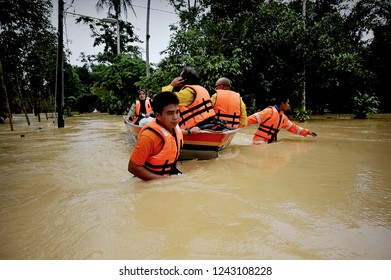 TERENGGANU, MALAYSIA: JANUARY 21, 2017 - Rescuers help flood victims move to a transfer centre by boat when water levels rise in Setiu.