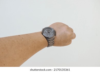 Terengganu, Malaysia - June 22, 2022: Image Of Hand Wearing Watch Fossil Brand In Isolated White Background