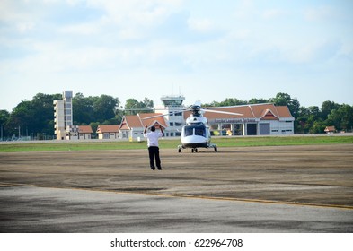 Terengganu,Malaysia-16 April 2017: Ground Crew Members Of Air Traffic Controllers Gives A Signal To A Helicopter Arrived At The Sultan Mahmud Airport, Terengganu.