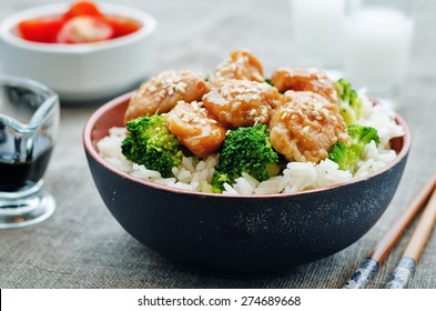teriyaki chicken and broccoli stir fry with rice. the toning. selective focus