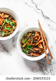 Teriyaki Chicken, Stir Fry Seasonal Autumn Vegetables With Soba Noodles On A Light Background, Top View