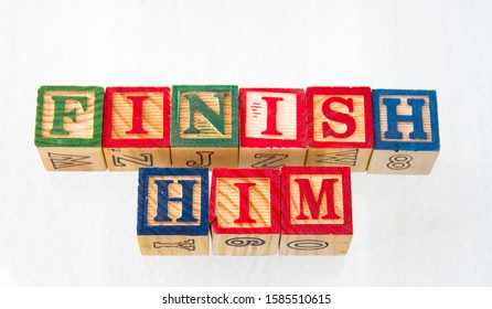 The Term Finish Him Work Visually Displayed On A White Background Using Toy Blocks Image With Copy Space