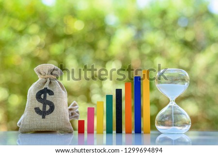 Term fund / time value of money / wealth creation, financial concept : US dollar bag, rising bar graph with hourglass, ideas about sustainable fund investment from private income for long term growth
