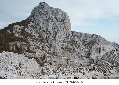 Termessos ancient city ruins in Turkiye, amphitheater in Taurus mountains, historical landmarks abandoned ruined buildings 