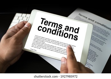 Terms and conditions businessman reviewing  terms and conditions of agreement office terms and conditions