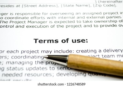 Terms Of Use With Wooden Pen