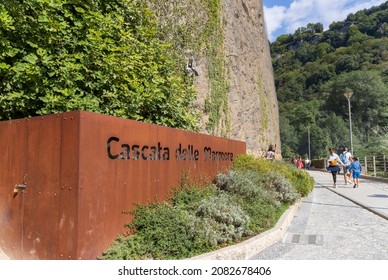 Terni, Italy - September 11 2021: Path of the lower belvedere of the Marmore Falls (Cascata delle Marmore) and the sign of the same waterfall.