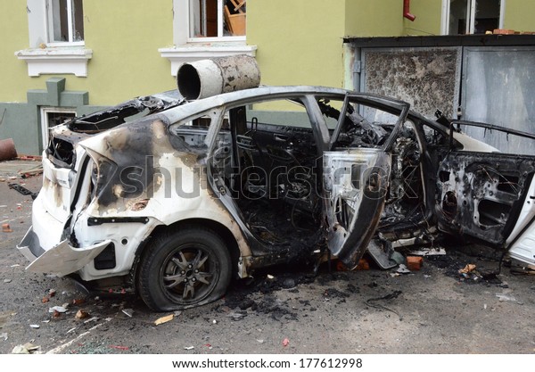 TERNOPIL, UKRAINE- FEBRUARY 18: Result of assault\
of city police department by activists Ukrainian revolution on\
February 18, 2014 in Ternopil, Ukraine. Protestants burned police\
department and cars.