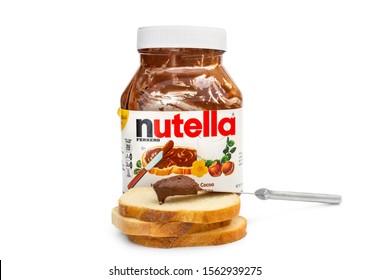 Ternopil, Ukraine - October 31, 2019: Opened Jar Of Nutella Chocolate Butter With Bread And Knife On White.