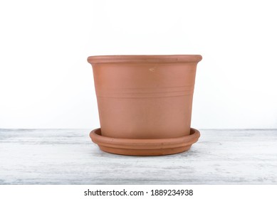 Terra Cotta Flower Pot Empty On A Table And On White Background