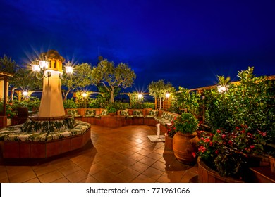 Terrace With The Beautiful Garden On The Roof With Fresh Green Plants Against The Blue Sky At Night In Rome, Italy