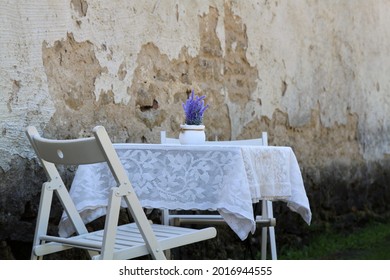 Terrace of a cafe near a castle wall. High quality photo. Selective focus