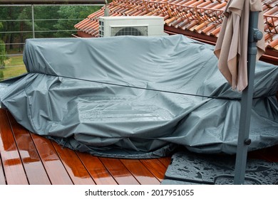 Terrace Furniture Cover Protecting Outdoor Furniture From Rain. Rainy Day.