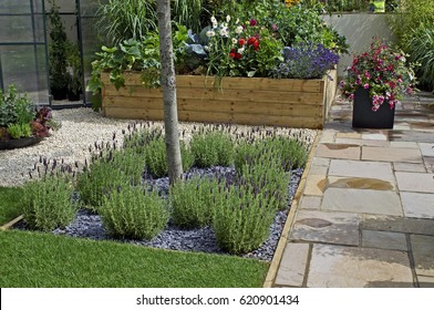 A Terrace Garden With Raised Beds And Container