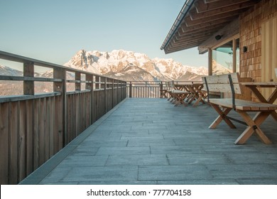 Terrace of a ski lodge with views of the mountains - Powered by Shutterstock