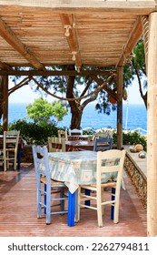 Terrace of a typical Greece tavern annex bar on the island Karpathos