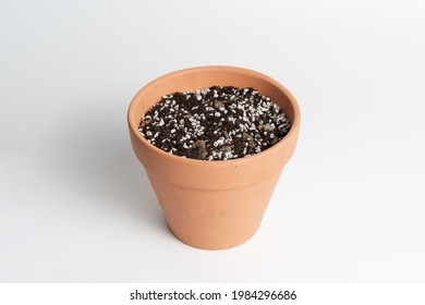 Terracotta Pot With Porous Soil Mixture In Isolated White Background. 