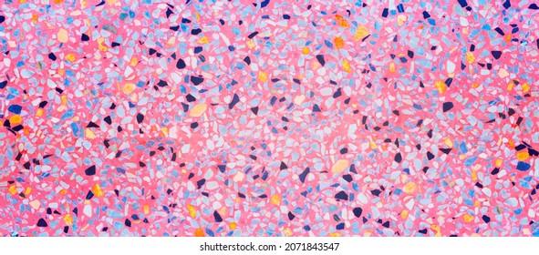 Terrazzo flooring marble stone wall texture abstract background. Colorful pink terrazzo floor tile on cement surface, architecture interior design pattern wallpaper material modern home decoration
