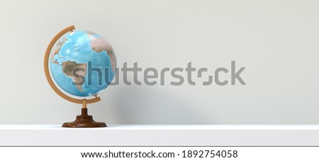 terrestrial globe on a shelf