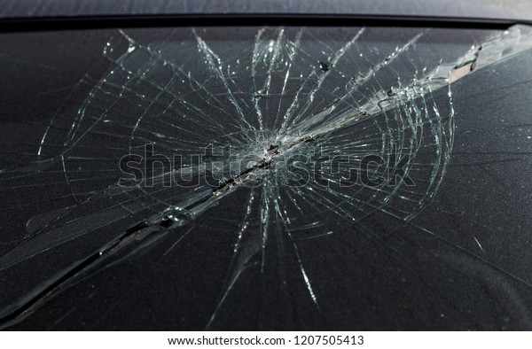 Terrible dangerous car after a fatal accident.\
Broken windshield. A broken car with broken glass. Сar hazard.\
Reckless dangerous driving. Broken windshield after fatal accident\
with a pedestrian