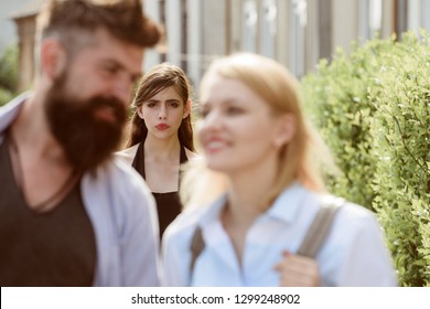 Terribly Jealous Of Them. Romantic Couple Of Man And Woman Dating. Bearded Man Cheating His Girlfriend With Another Woman. Jealous Woman Look At Couple In Love On Street. Unhappy Girl Feeling Jealous.