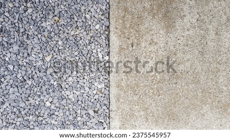 Terrific half-frame shot displaying an abstract contrast between stone and cement.