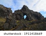 Terrific looking rock formation with a natural doorway in Iceland.