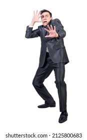 Terrified Man In Light Studio. White Background.