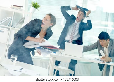 Terrified office workers screaming in office in smoke