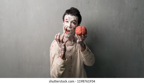 Terrorific Zombie Eating A Brain.  Halloween Holidays