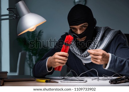 Terrorist bomber preparing dynamite bomb