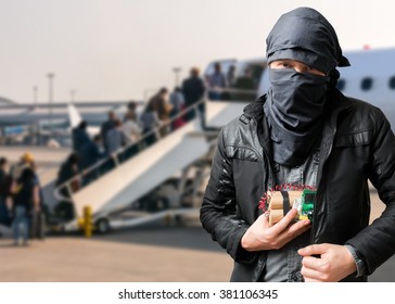 Terrorist Has Dynamite Bomb In Jacket In Airport. Terrorism Concept.