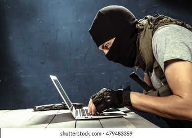 Terrorist Working On His Computer