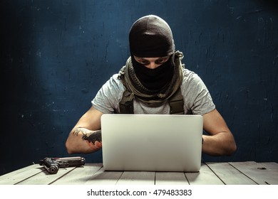 Terrorist Working On His Computer