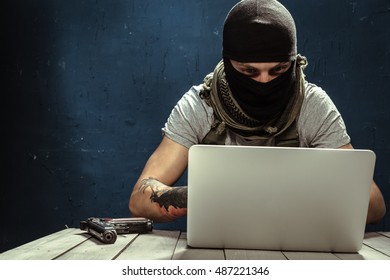 Terrorist Working On His Computer