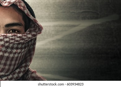 terrorists half face and eyes contact with masked and grunge background, terrorism and criminal concept