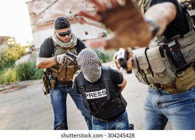 Terrorists Holding A Gun To A Photo Journalist Head