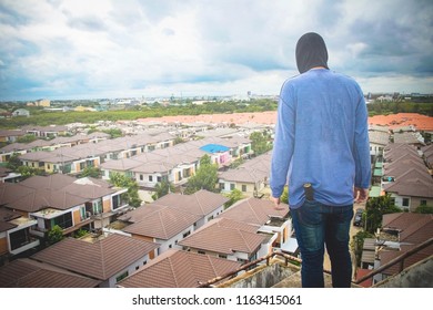 
Terrorists stand looking at the high to plan waiting time for a house robbery in a housing estate.
