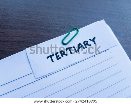 Tertiary writting on table background. 
