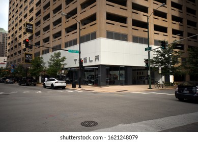 Tesla Car Dealership Store Front Entrance And Sign As Seen From Across The Street Corner, Chicago, IL September 19, 2019